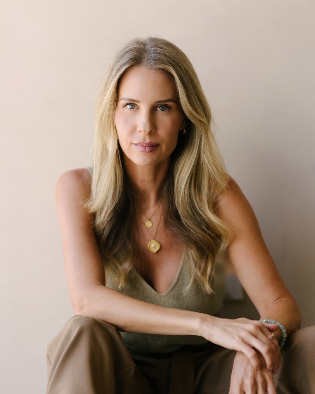 Portrait of Elle Wilk, seated and looking directly at the camera